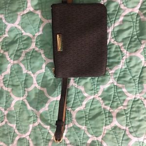 Fashionable and chic Michael Kors belted wallet.